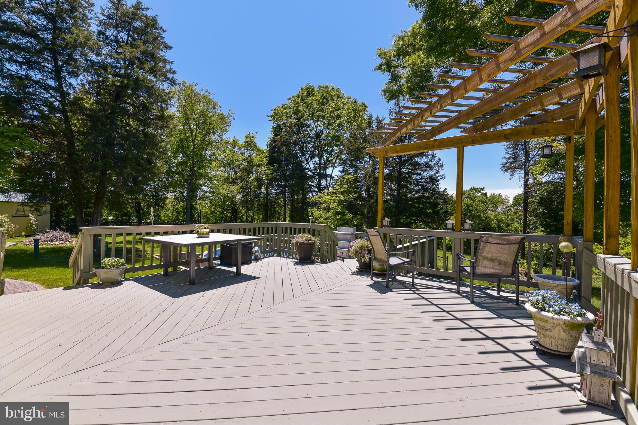 8033 Waterloo Farm Road Warrenton, VA 20186 - Photo 26 of 30 a view of roof deck with chairs and potted plants