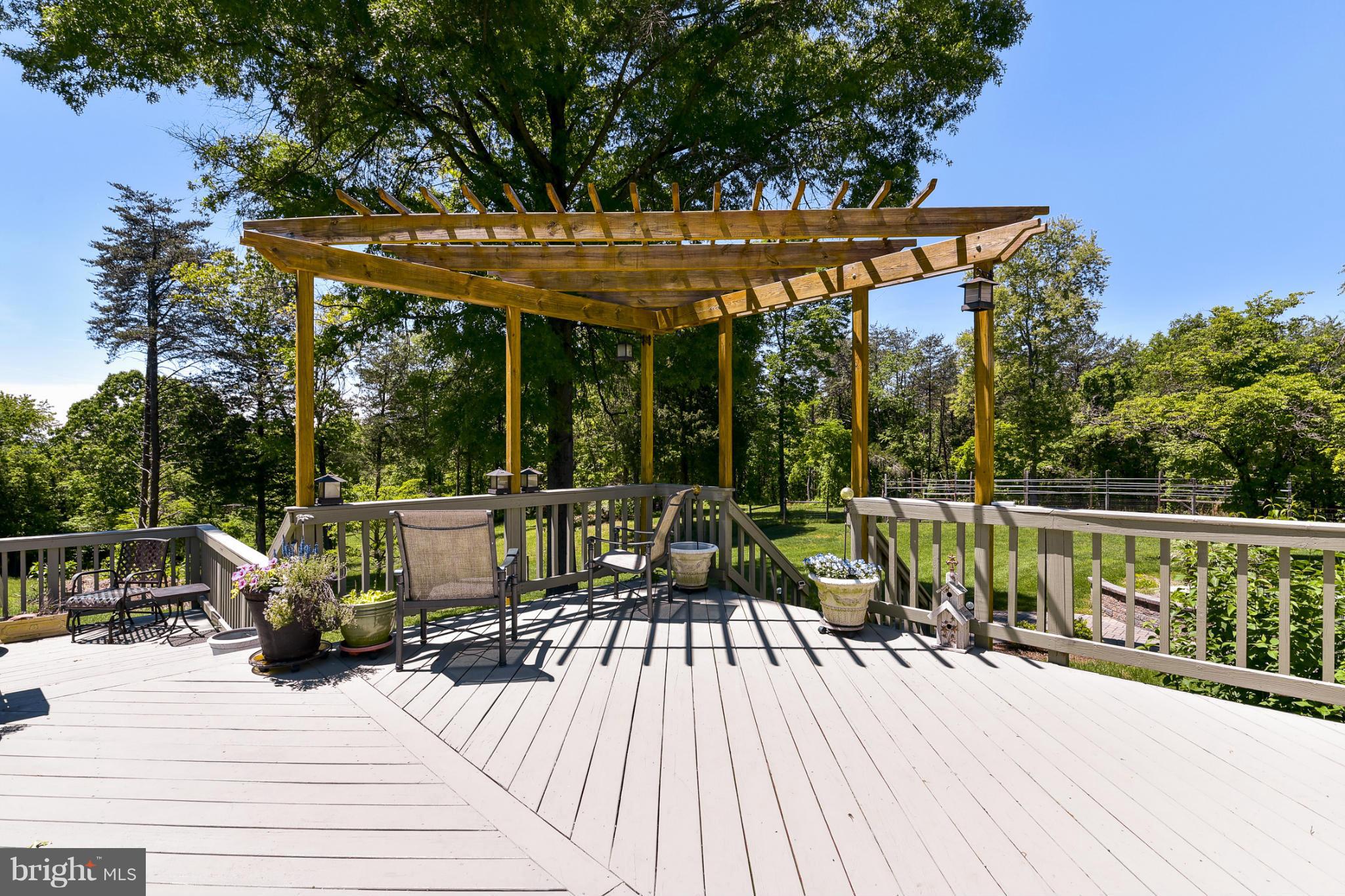 8033 Waterloo Farm Road Warrenton, VA 20186 - Photo 28 of 30 a view of balcony with chairs and wooden floor