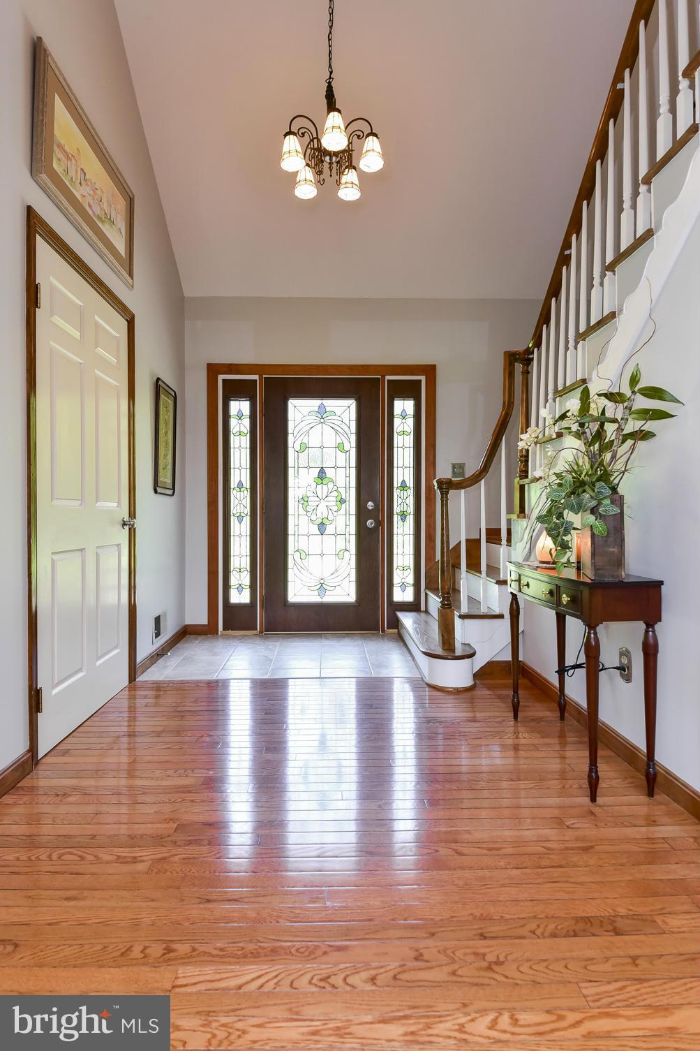 8033 Waterloo Farm Road Warrenton, VA 20186 - Photo 5 of 30 a view of an entryway with wooden floor and a livingroom