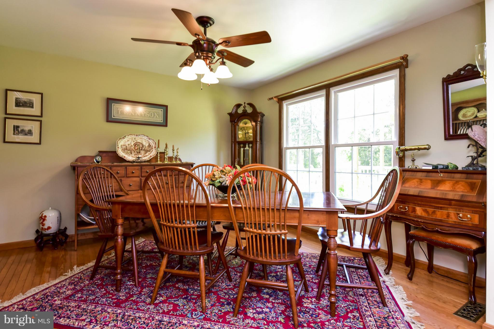 8033 Waterloo Farm Road Warrenton, VA 20186 - Photo 10 of 30 a view of a dining room with furniture window and wooden floor