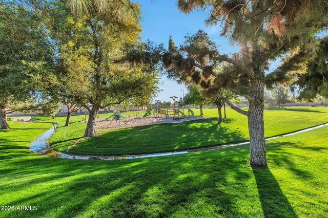 a view of a golf course with a big yard