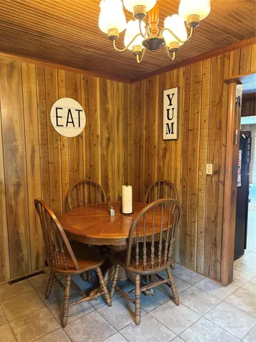 a view of a chairs and table in the balcony