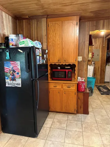 a kitchen with stainless steel appliances granite countertop a refrigerator and a stove