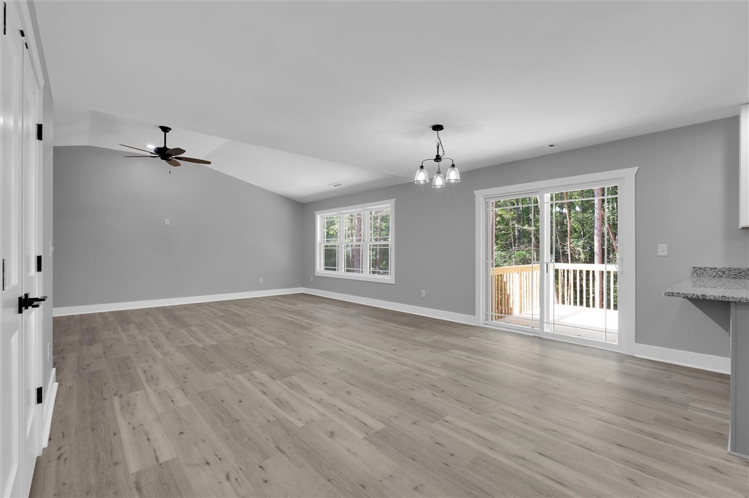 1747 A State Rd S-4-97 Anderson, SC 29621 - Photo 13 of 47 Sun-drenched living space featuring durable flooring and direct deck access.