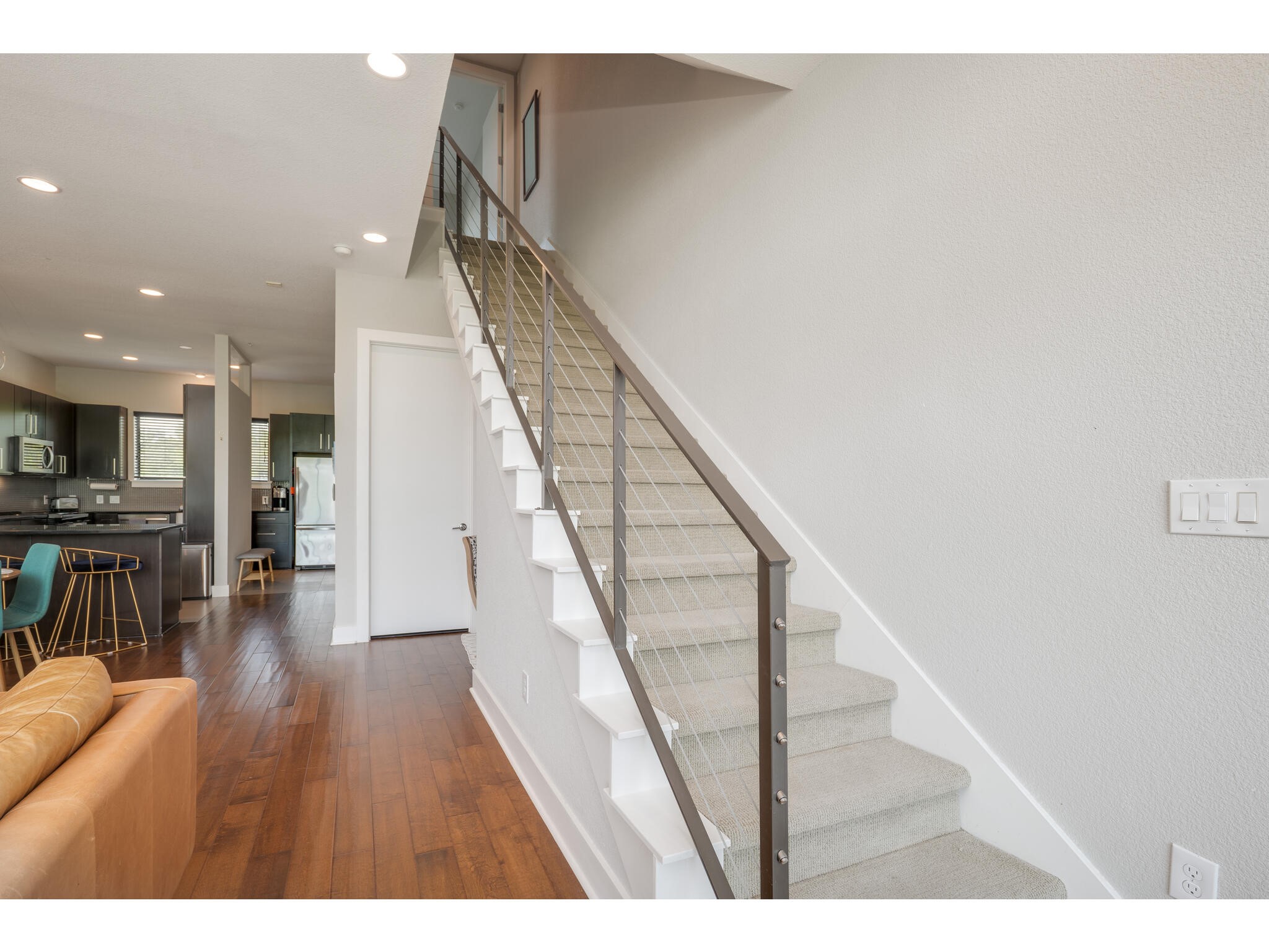 1101 Ivean Pearson Road, Unit A203 Lago Vista, TX 78645 - Photo 13 of 27 A modern steel cable staircase
leads you to the 2nd level, where
both the primary and secondary
rooms await.