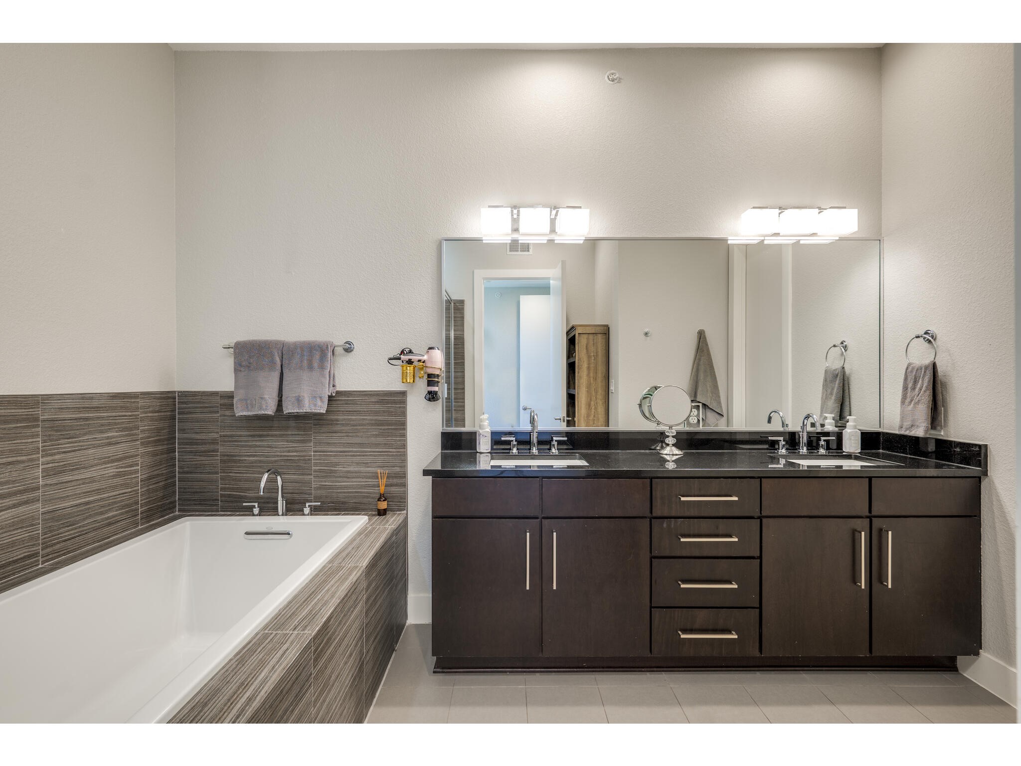 1101 Ivean Pearson Road, Unit A203 Lago Vista, TX 78645 - Photo 15 of 27 The primary's ensuite is thoughtfully put together, with smart details and a layout that works.