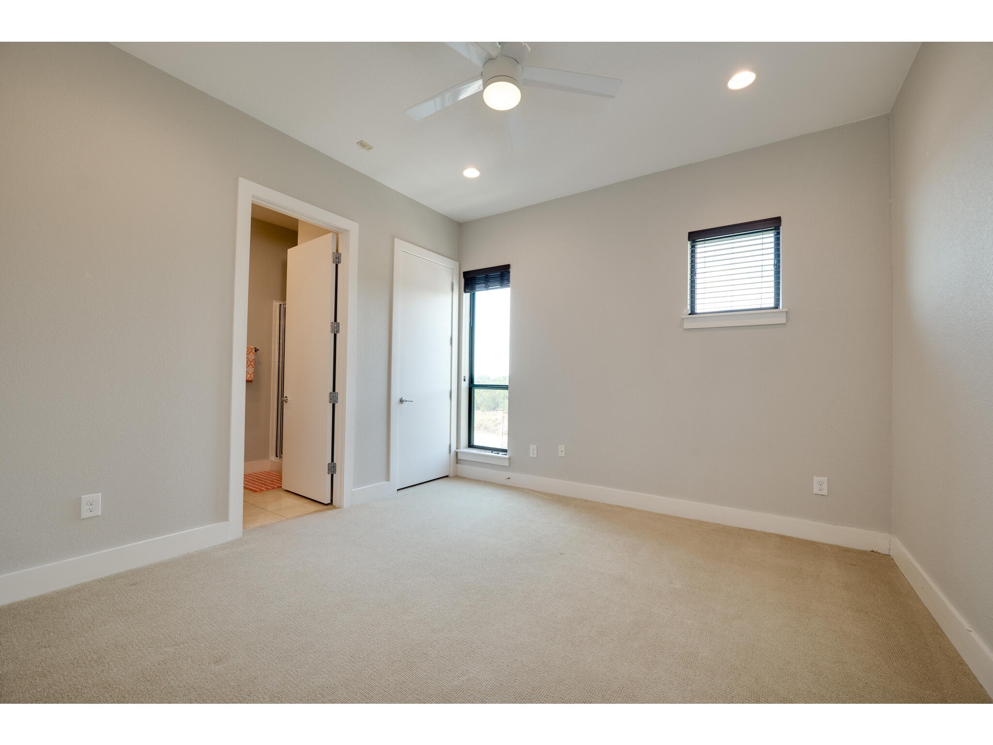 1101 Ivean Pearson Road, Unit A203 Lago Vista, TX 78645 - Photo 17 of 27 This secondary bedroom is
spacious and features it's own ensuite.