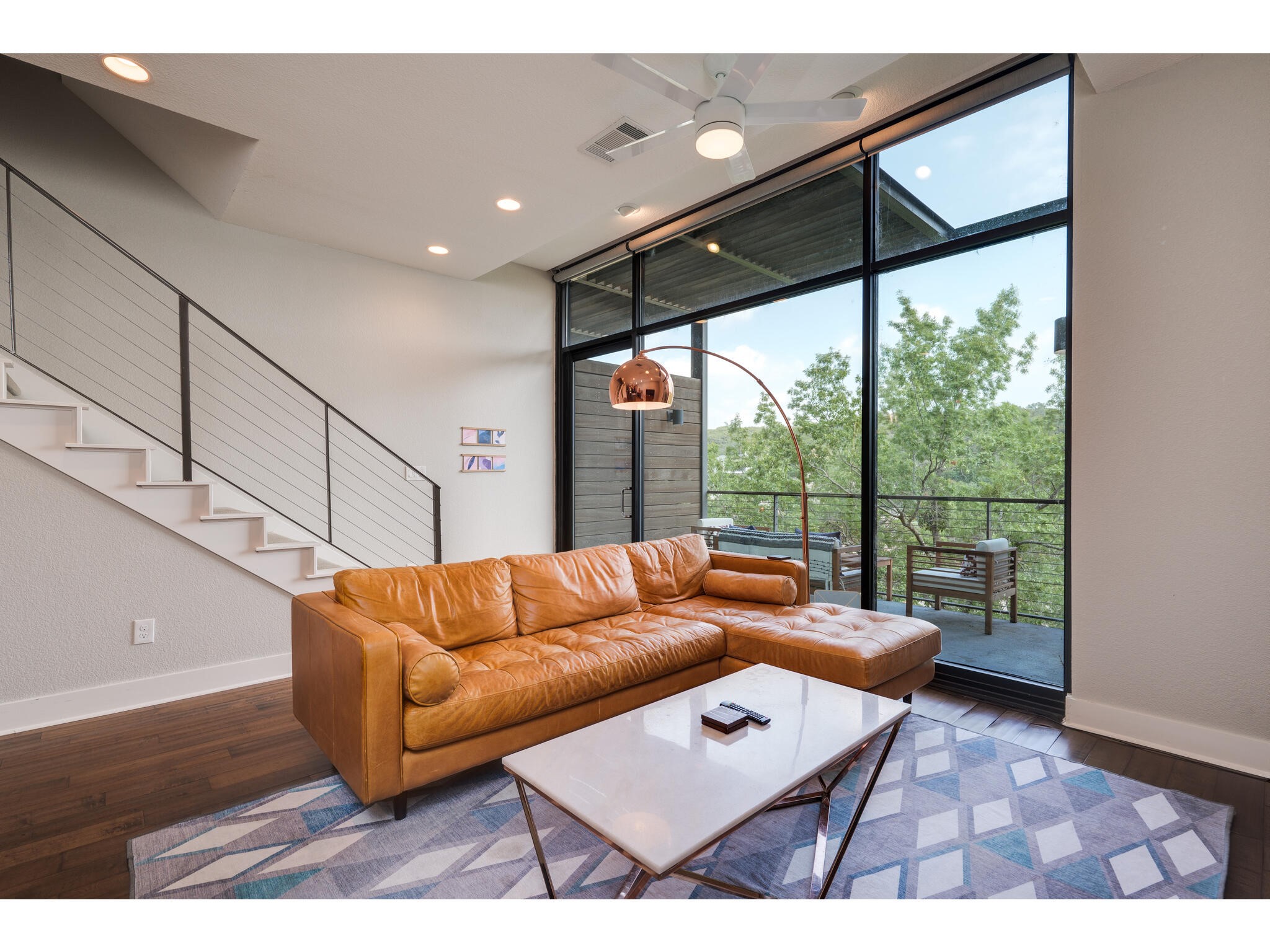 1101 Ivean Pearson Road, Unit A203 Lago Vista, TX 78645 - Photo 3 of 27 Easily enjoy indoor-outdoor living
by stepping from the living room
onto your covered balcony where
you can take in the hill country views!