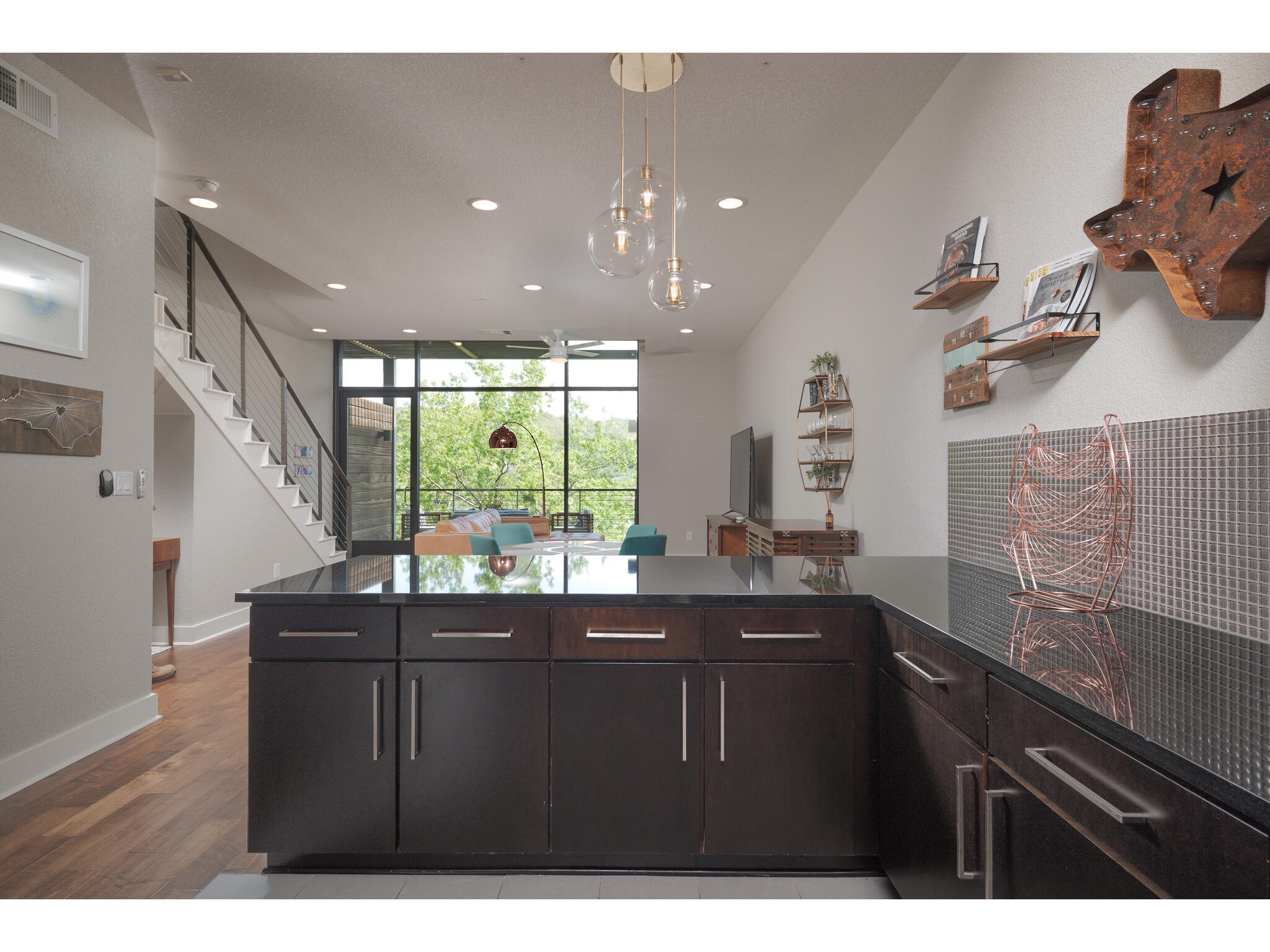 1101 Ivean Pearson Road, Unit A203 Lago Vista, TX 78645 - Photo 5 of 27 Never get FOMO while preparing
a meal in this kitchen. The views
are in the backdrop and your
guests are always nearby.