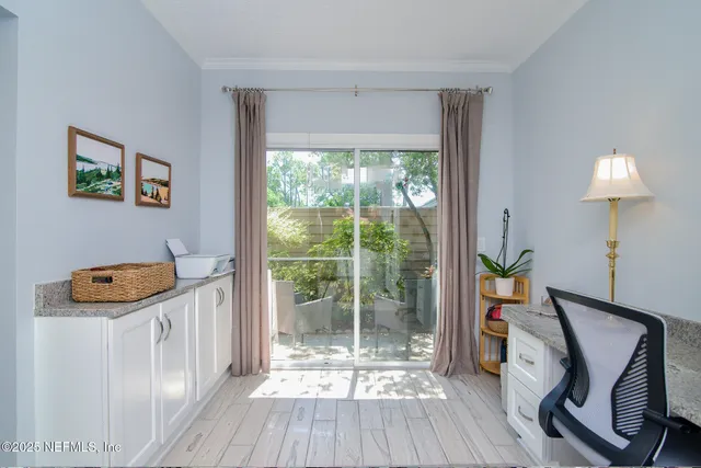 a view of balcony with wooden floor and outdoor seating