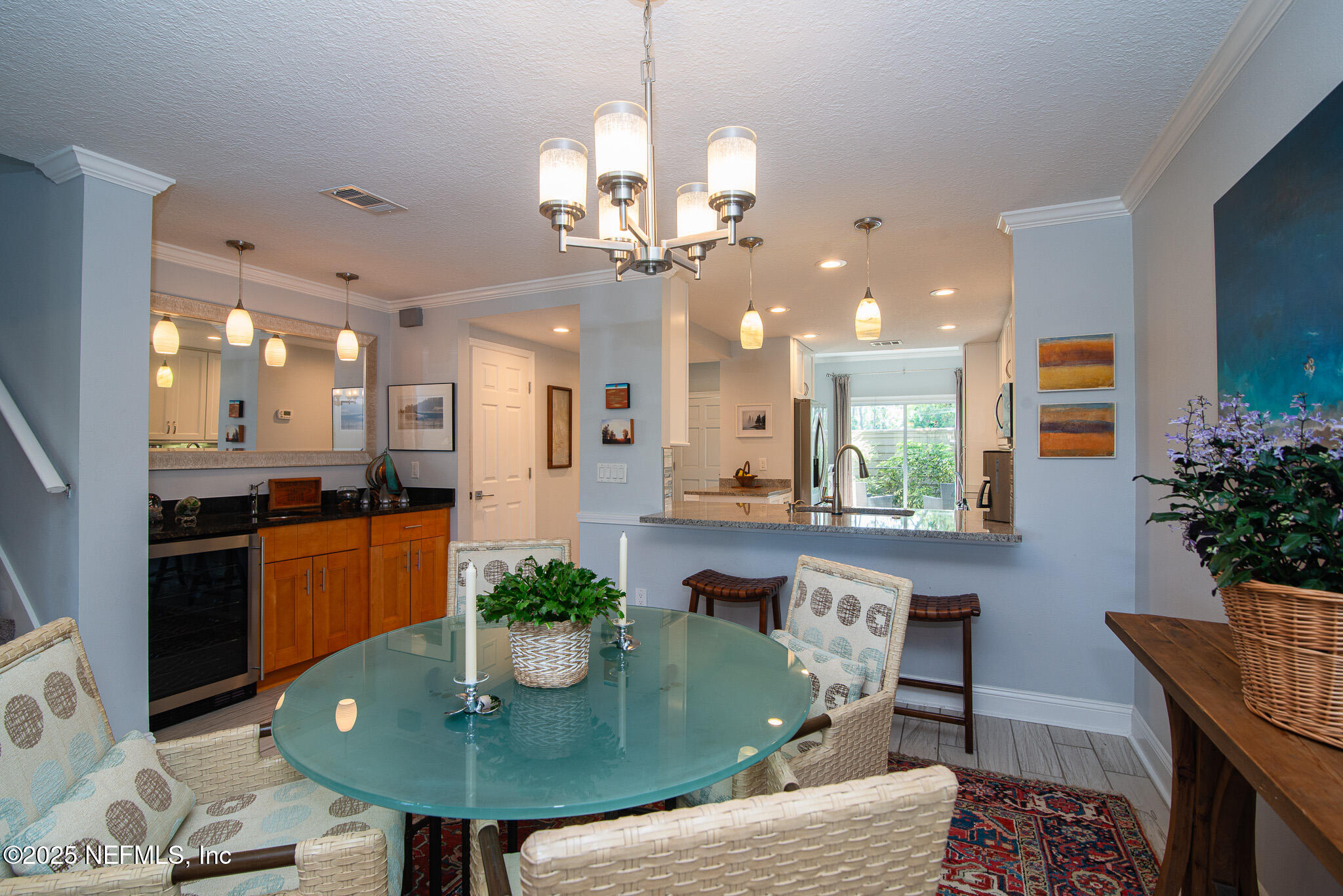 36 Fishermans Cove Road Ponte Vedra Beach, FL 32082 - Photo 14 of 51 a kitchen with a table chairs and chandelier