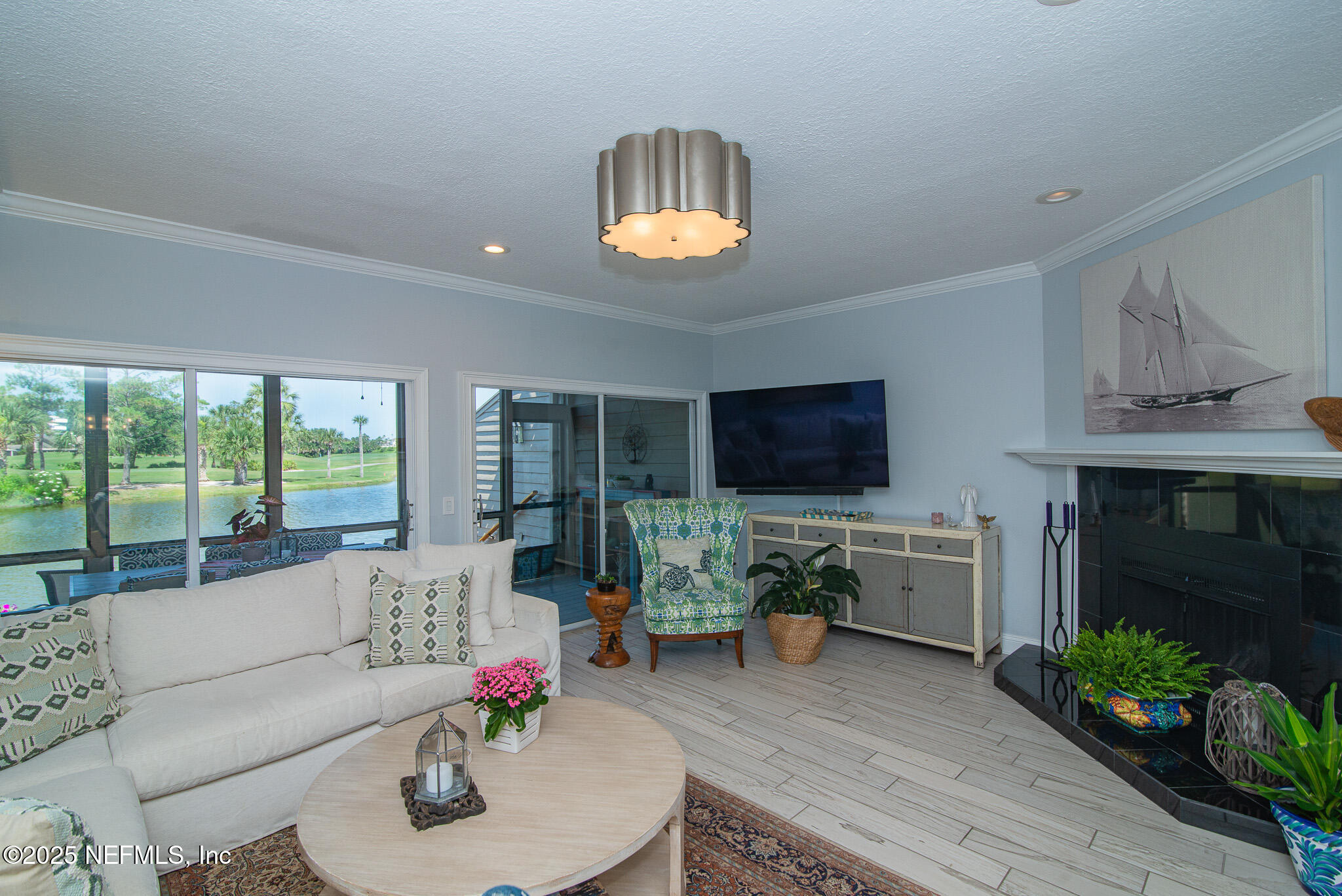 36 Fishermans Cove Road Ponte Vedra Beach, FL 32082 - Photo 17 of 51 a living room with furniture fireplace and a flat screen tv