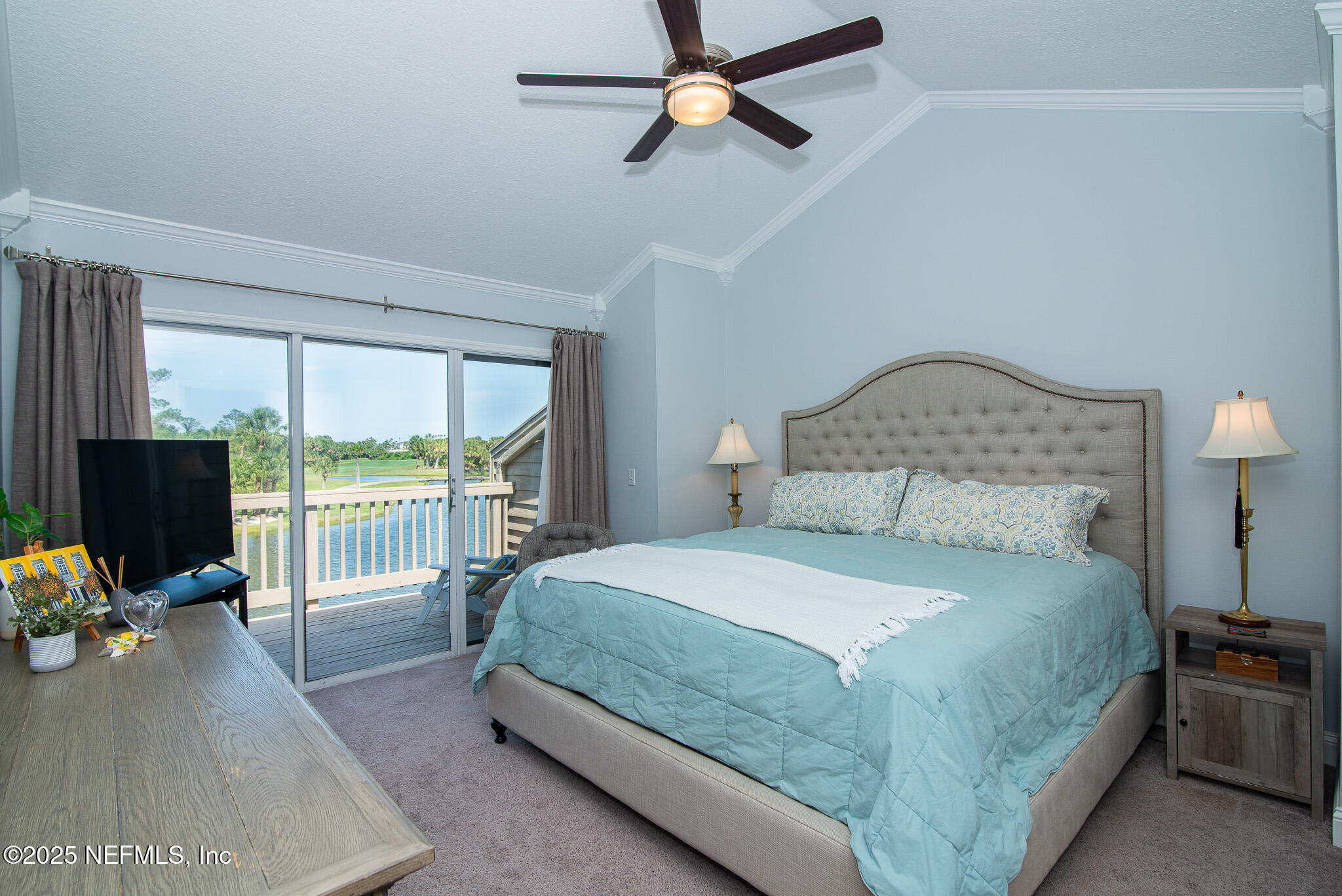 36 Fishermans Cove Road Ponte Vedra Beach, FL 32082 - Photo 27 of 51 a bedroom with a bed a flat screen tv and a large window