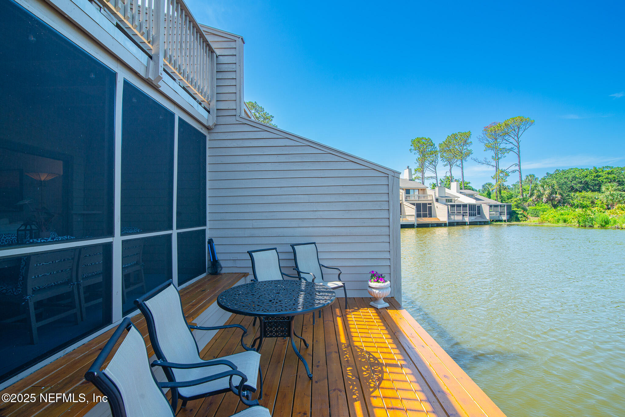 36 Fishermans Cove Road Ponte Vedra Beach, FL 32082 - Photo 4 of 51 a view of balcony with wooden floor and outdoor seating