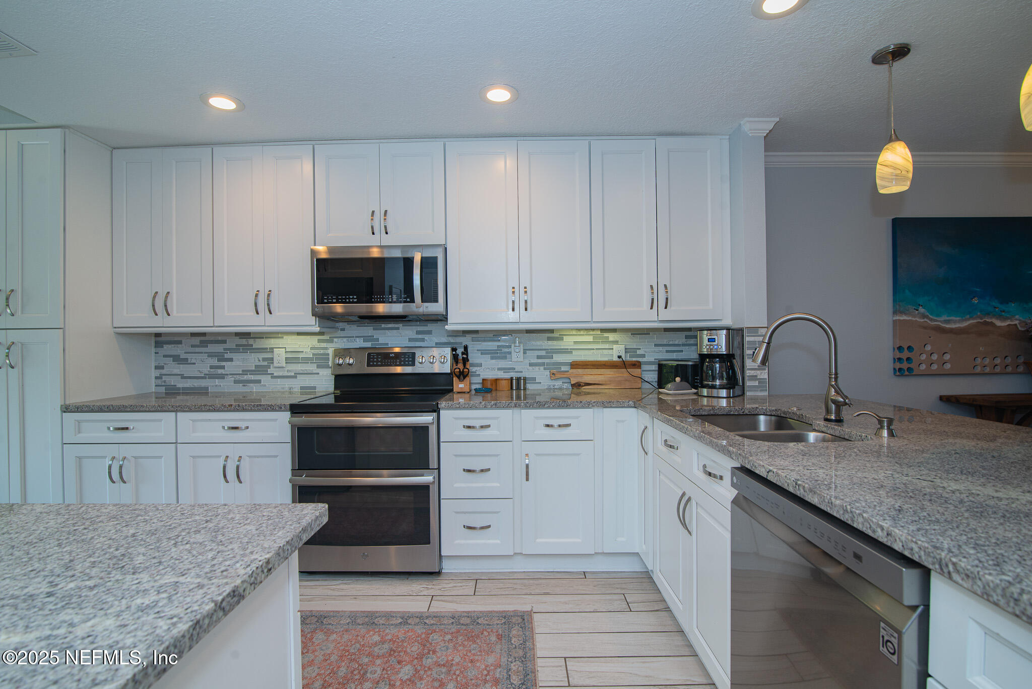 36 Fishermans Cove Road Ponte Vedra Beach, FL 32082 - Photo 9 of 51 a kitchen with granite countertop a stove and a sink