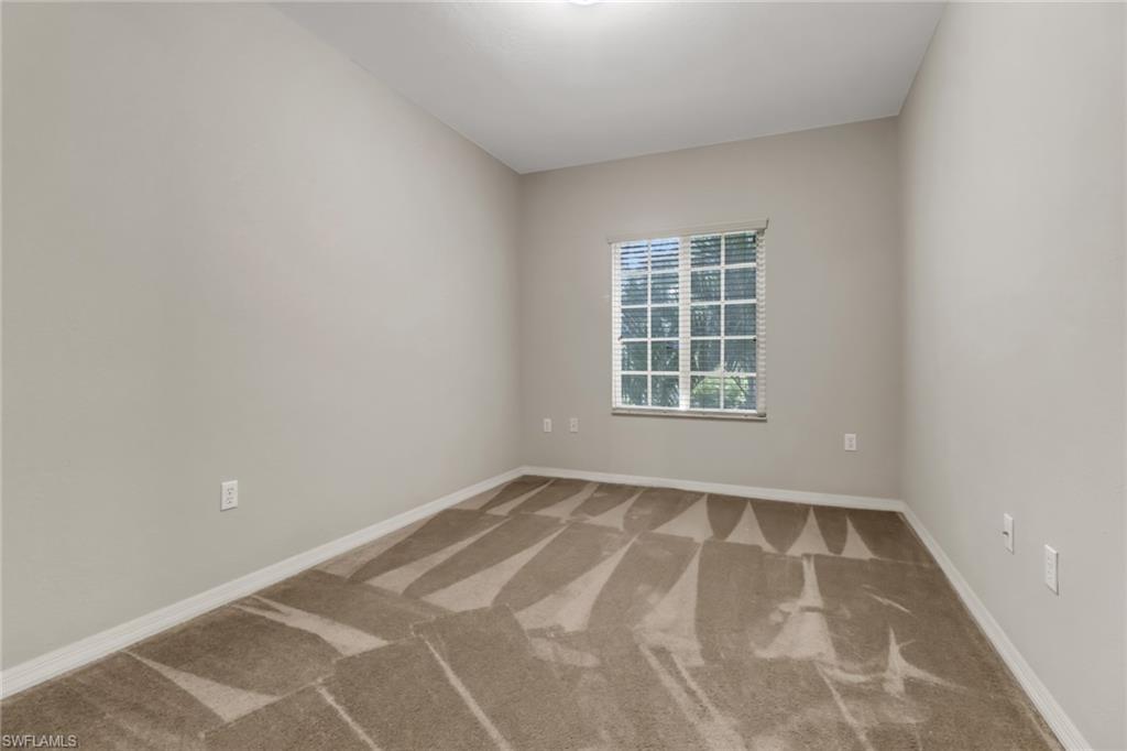 20160 Estero Gardens Circle, Unit 202 Estero, FL 33928 - Photo 12 of 44 a view of an empty room with a window