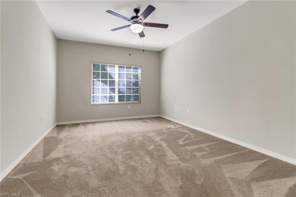 20160 Estero Gardens Circle, Unit 202 Estero, FL 33928 - Photo 14 of 44 a view of an empty room with a window