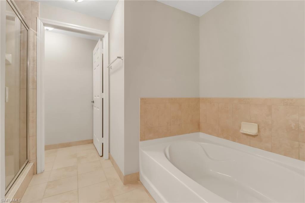 20160 Estero Gardens Circle, Unit 202 Estero, FL 33928 - Photo 17 of 44 a bathroom with a bathtub