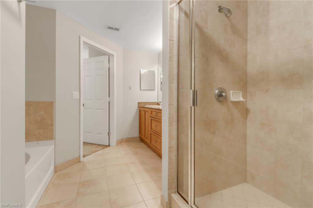 20160 Estero Gardens Circle, Unit 202 Estero, FL 33928 - Photo 18 of 44 a bathroom with a shower and a sink