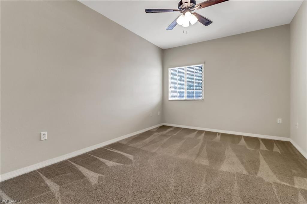 20160 Estero Gardens Circle, Unit 202 Estero, FL 33928 - Photo 19 of 44 an empty room with a window and a fan