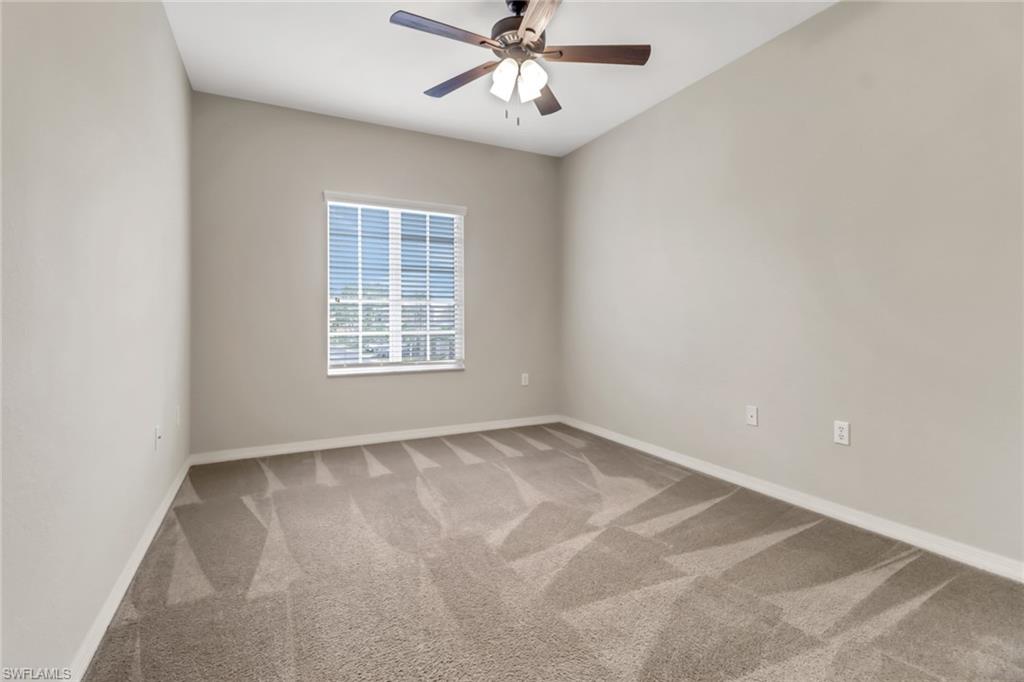 20160 Estero Gardens Circle, Unit 202 Estero, FL 33928 - Photo 22 of 44 an empty room with windows and fan