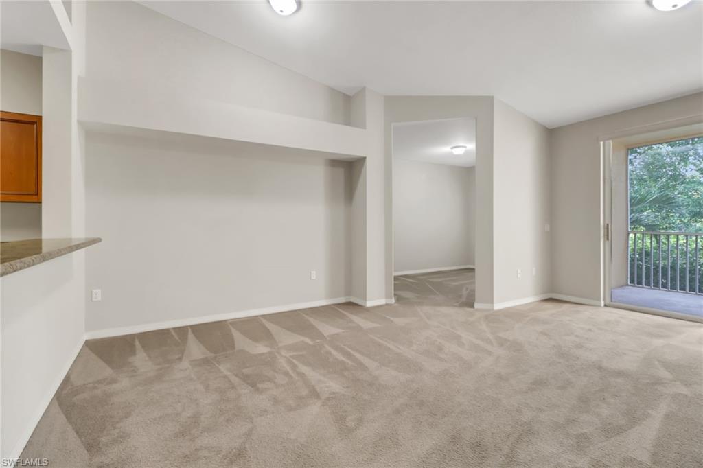 20160 Estero Gardens Circle, Unit 202 Estero, FL 33928 - Photo 9 of 44 an empty room with windows