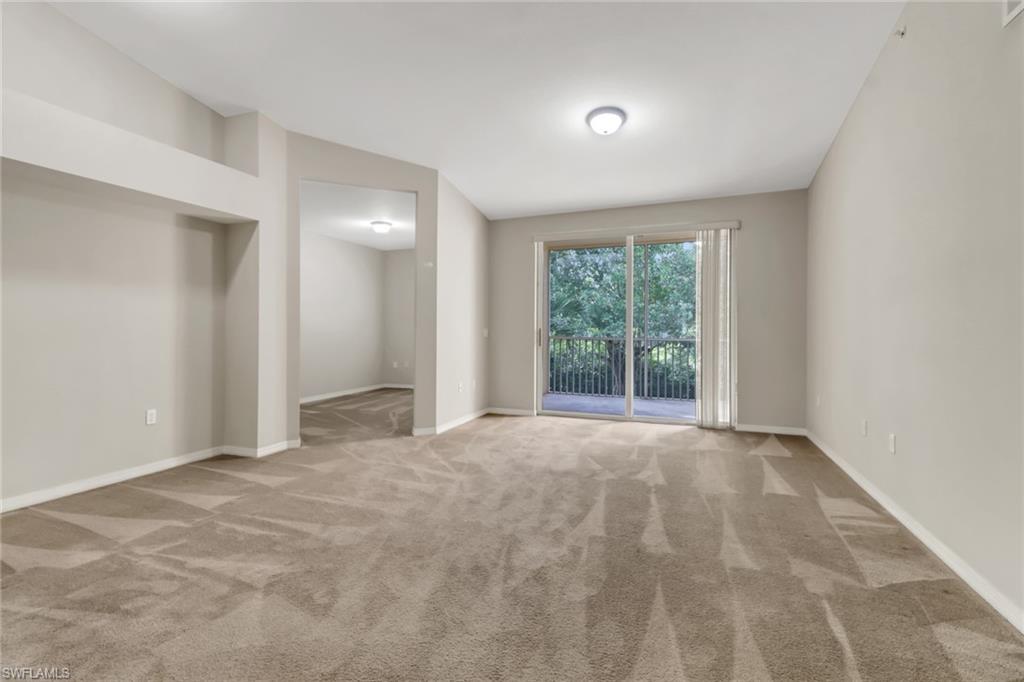 20160 Estero Gardens Circle, Unit 202 Estero, FL 33928 - Photo 10 of 44 a view of an empty room with a window