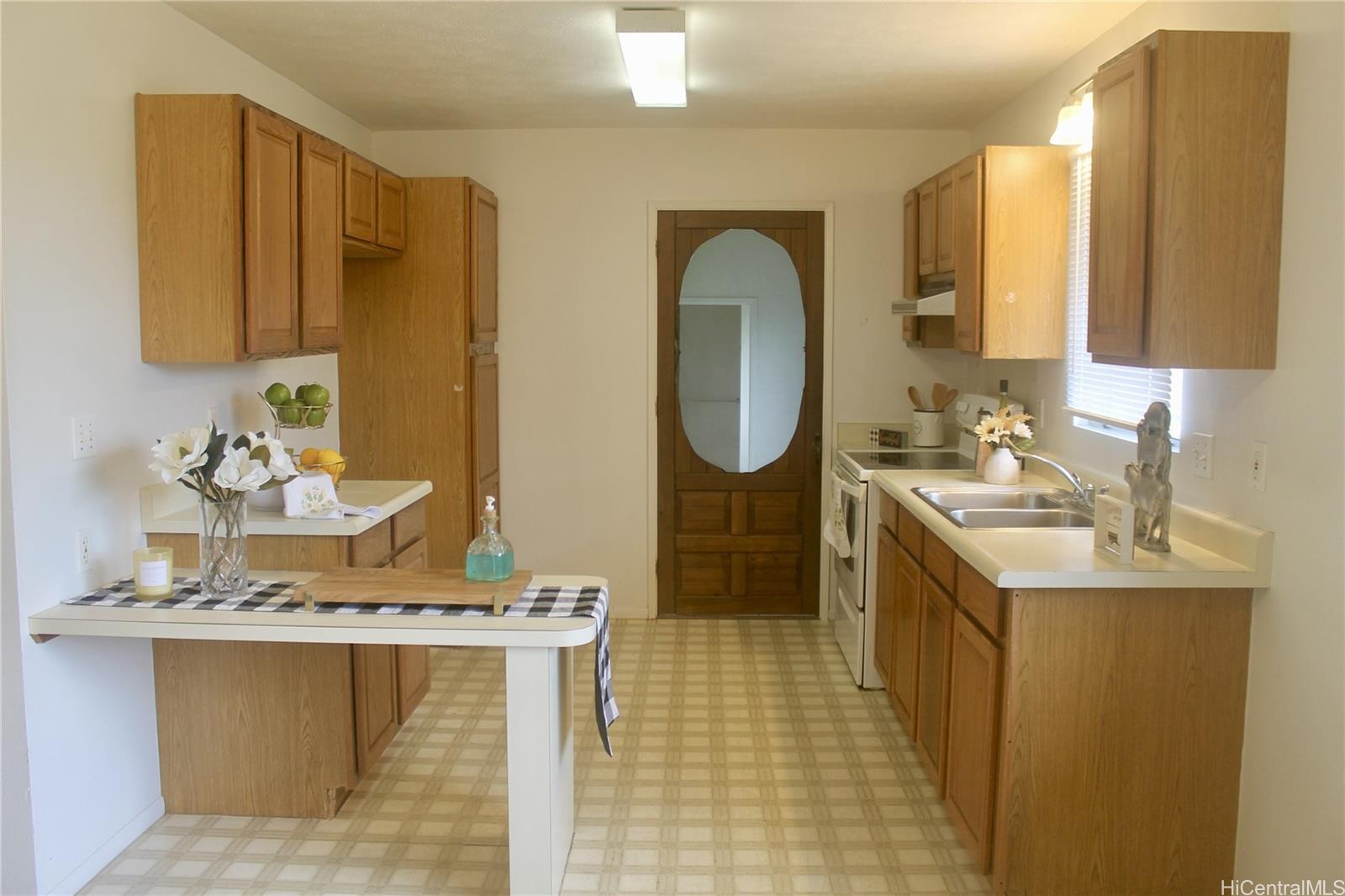 17-303 Pilikino Road Kurtistown, HI 96760 - Photo 11 of 19 a bathroom with a sink a mirror and a shower
