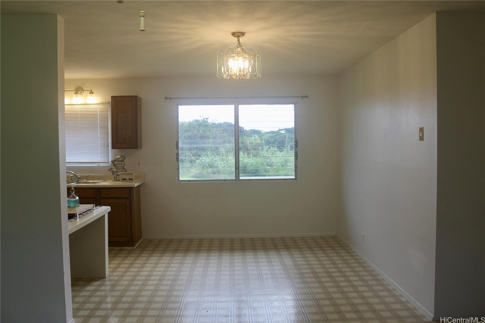 17-303 Pilikino Road Kurtistown, HI 96760 - Photo 12 of 19 a view of a livingroom with furniture and window