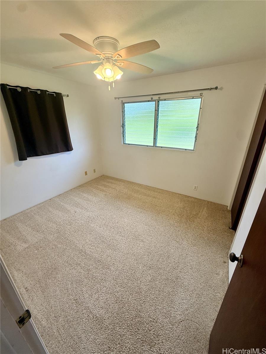 17-303 Pilikino Road Kurtistown, HI 96760 - Photo 18 of 19 a view of an empty room with a window