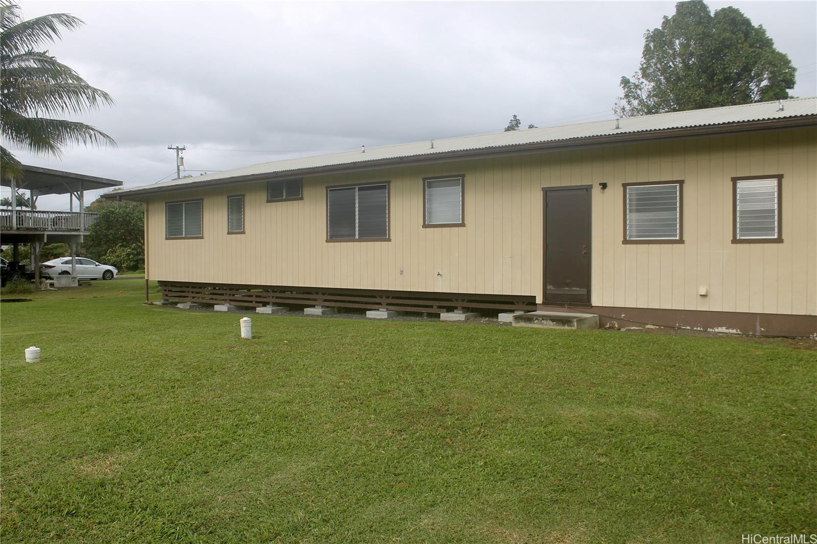 17-303 Pilikino Road Kurtistown, HI 96760 - Photo 6 of 19 a front view of house with yard and trees