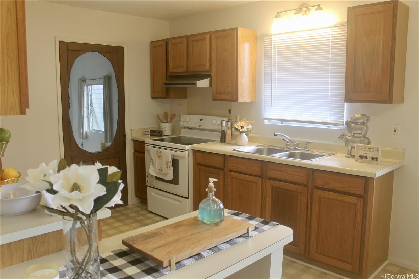 17-303 Pilikino Road Kurtistown, HI 96760 - Photo 10 of 19 a bathroom with a sink double vanity and a mirror