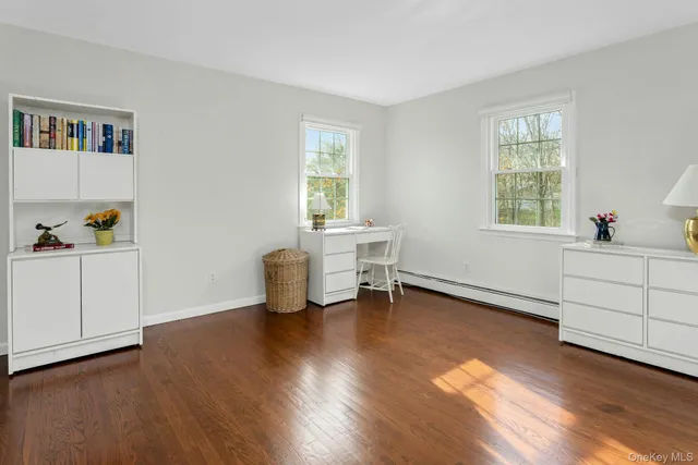 a view of a livingroom with furniture and a window