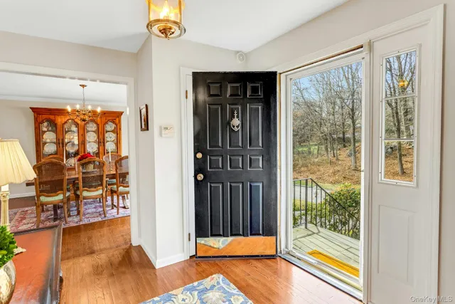 a view of a hardwood & floor to ceiling window