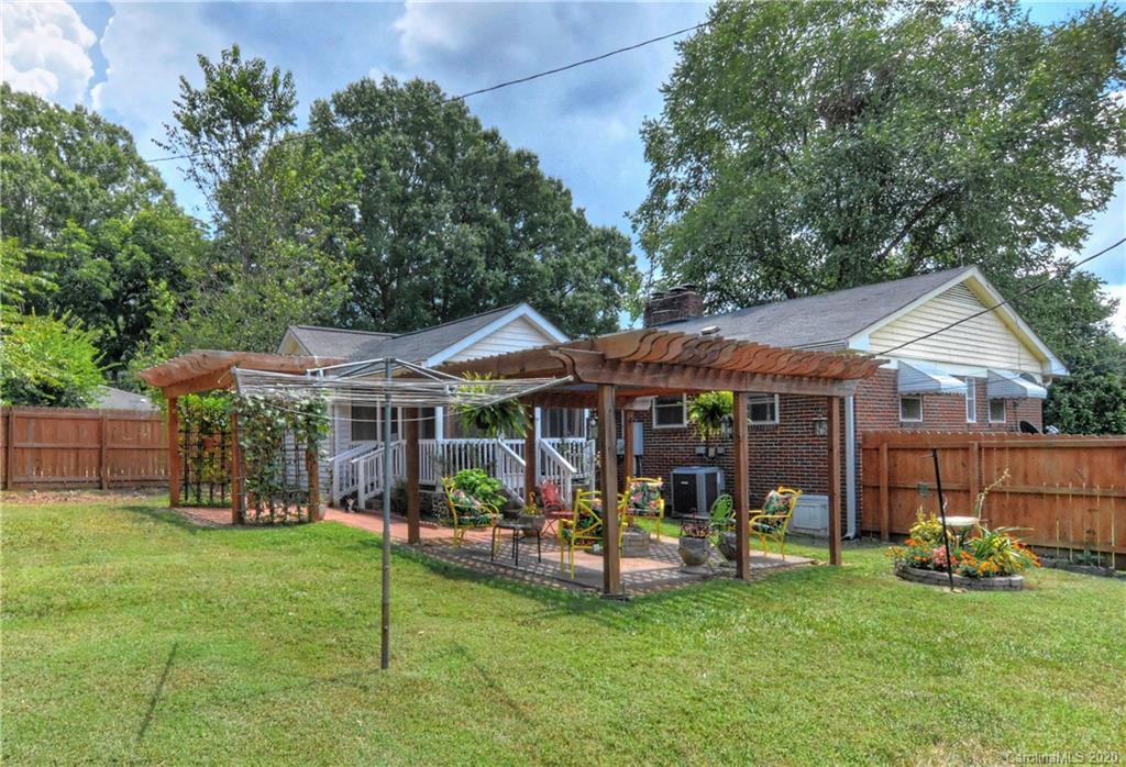 5700 Paw Creek Road Charlotte, NC 28214 - Photo 15 of 19 a view of a house with a garden and porch
