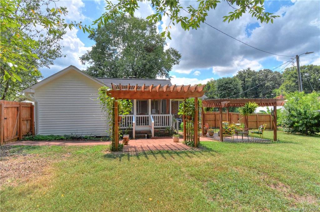 5700 Paw Creek Road Charlotte, NC 28214 - Photo 17 of 19 a view of a house with backyard and porch