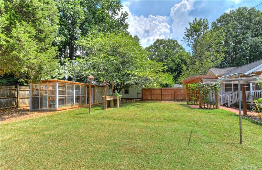 5700 Paw Creek Road Charlotte, NC 28214 - Photo 18 of 19 a view of a house with a yard and sitting area