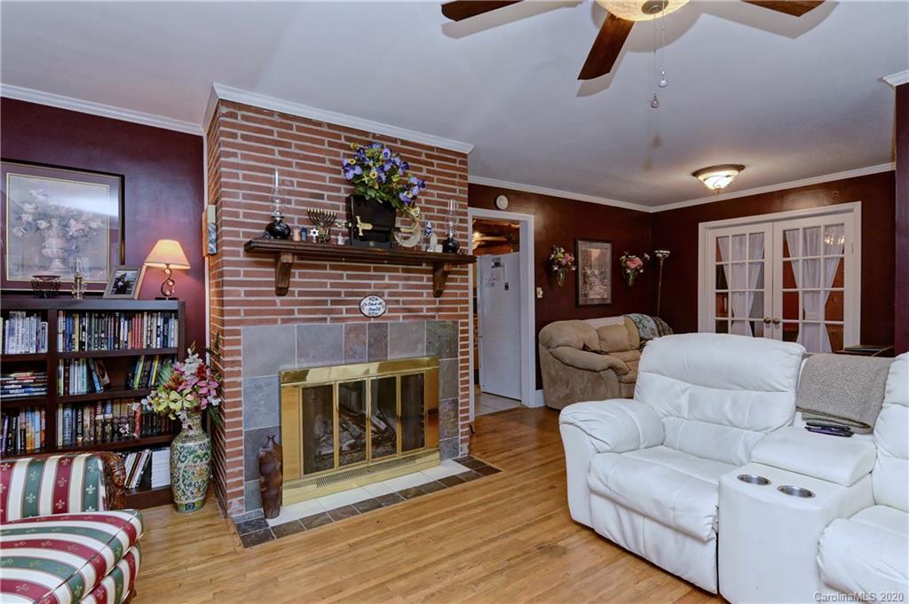 5700 Paw Creek Road Charlotte, NC 28214 - Photo 4 of 19 a living room with furniture and a fireplace