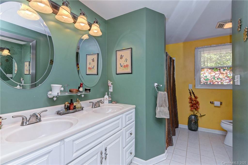 5700 Paw Creek Road Charlotte, NC 28214 - Photo 8 of 19 a bathroom with a sink and a mirror