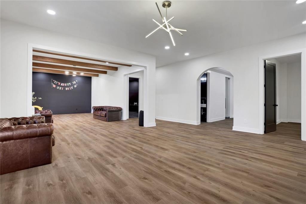 1200 Moores Mill Road Northwest Atlanta, GA 30327 - Photo 16 of 73 a view of a livingroom with a furniture wooden floor and window