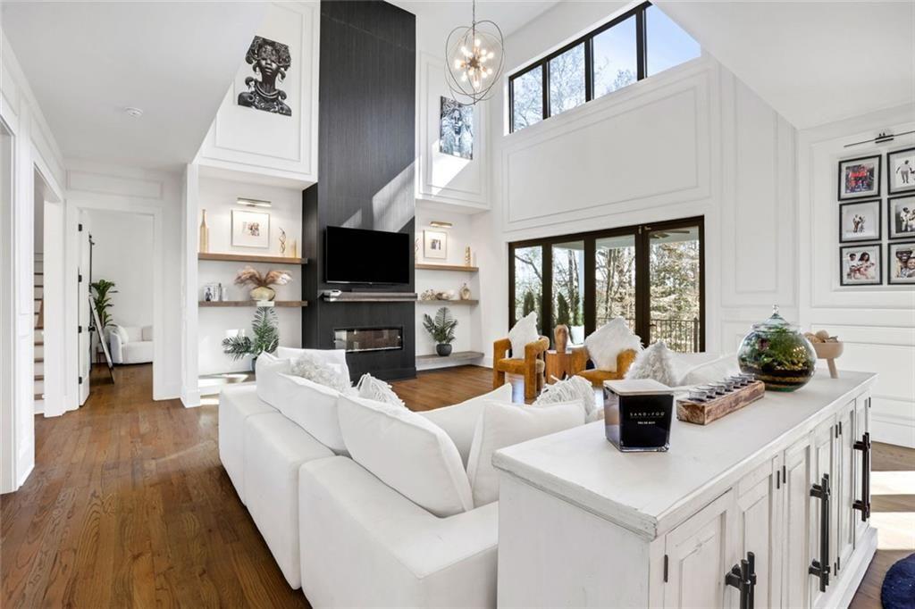 1200 Moores Mill Road Northwest Atlanta, GA 30327 - Photo 18 of 73 a living room with fireplace furniture and a flat screen tv
