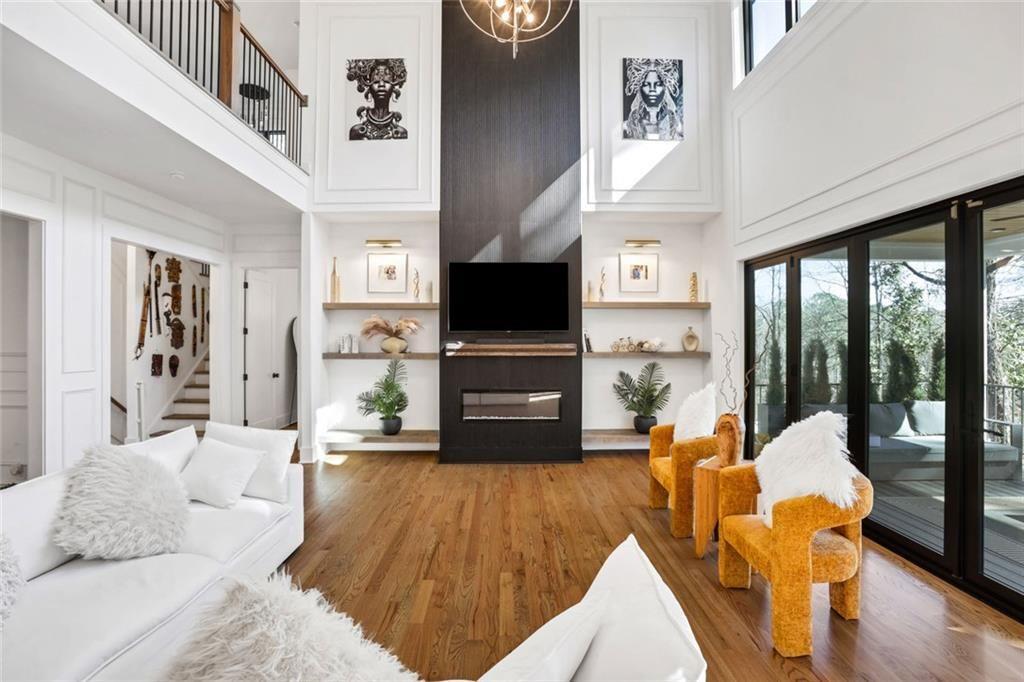 1200 Moores Mill Road Northwest Atlanta, GA 30327 - Photo 19 of 73 a living room with furniture and a flat screen tv