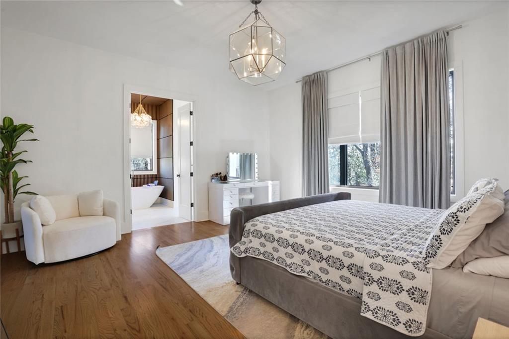 1200 Moores Mill Road Northwest Atlanta, GA 30327 - Photo 36 of 73 a bedroom with a large bed and a couch