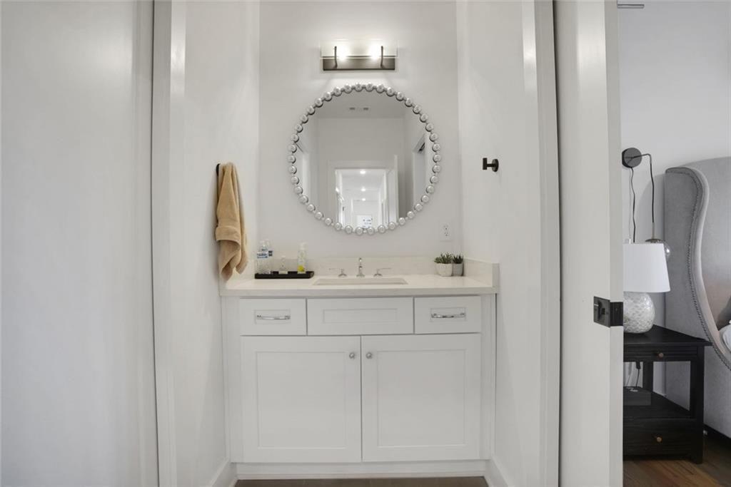 1200 Moores Mill Road Northwest Atlanta, GA 30327 - Photo 43 of 73 a bathroom with a sink vanity and mirror