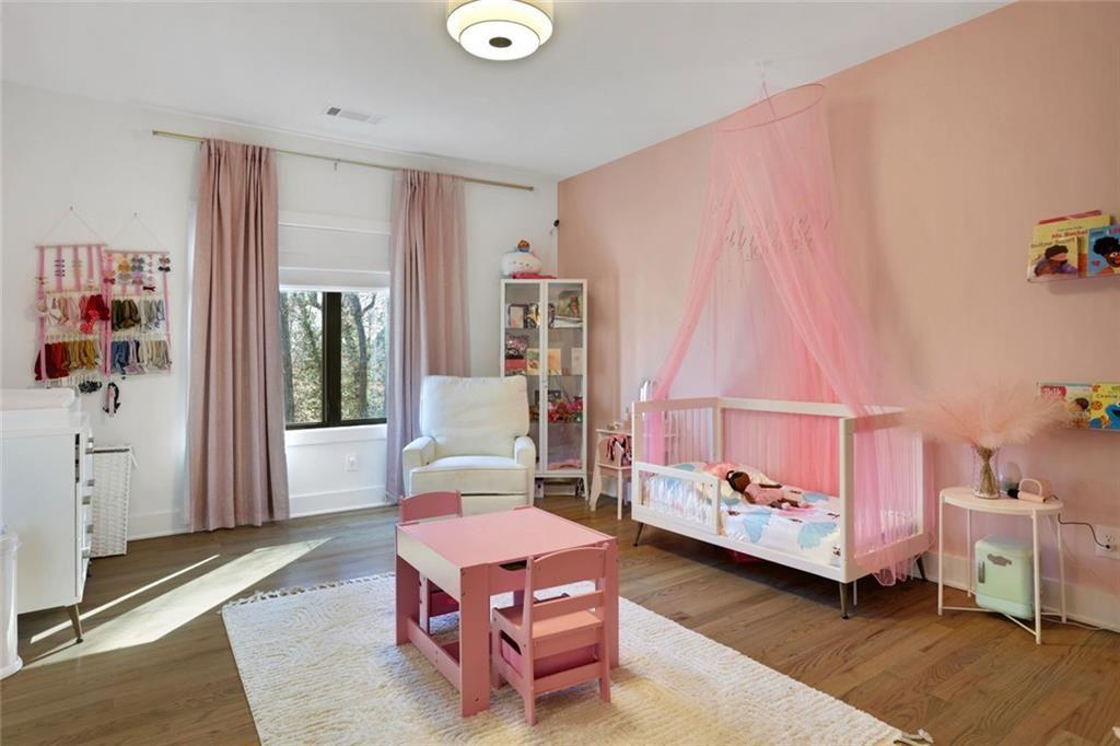 1200 Moores Mill Road Northwest Atlanta, GA 30327 - Photo 52 of 73 a living room with furniture and a baby crib