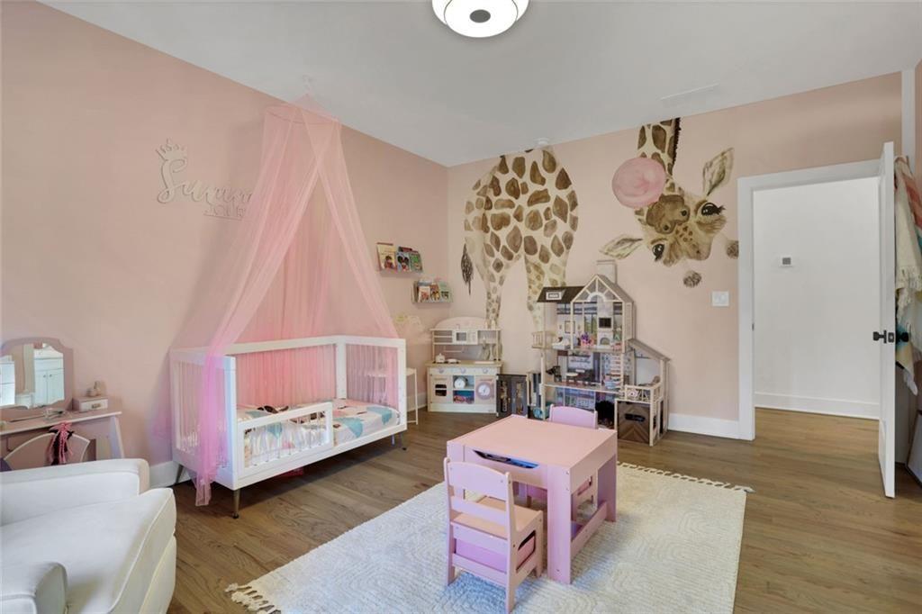 1200 Moores Mill Road Northwest Atlanta, GA 30327 - Photo 53 of 73 a bedroom with furniture and a baby crib