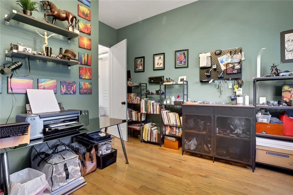 1200 Moores Mill Road Northwest Atlanta, GA 30327 - Photo 66 of 73 a living room with furniture and a flat screen tv
