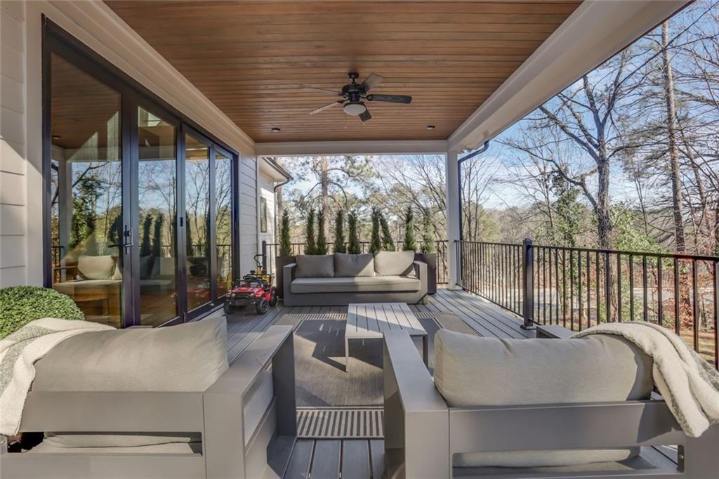 1200 Moores Mill Road Northwest Atlanta, GA 30327 - Photo 68 of 73 a living room with patio furniture and a large window