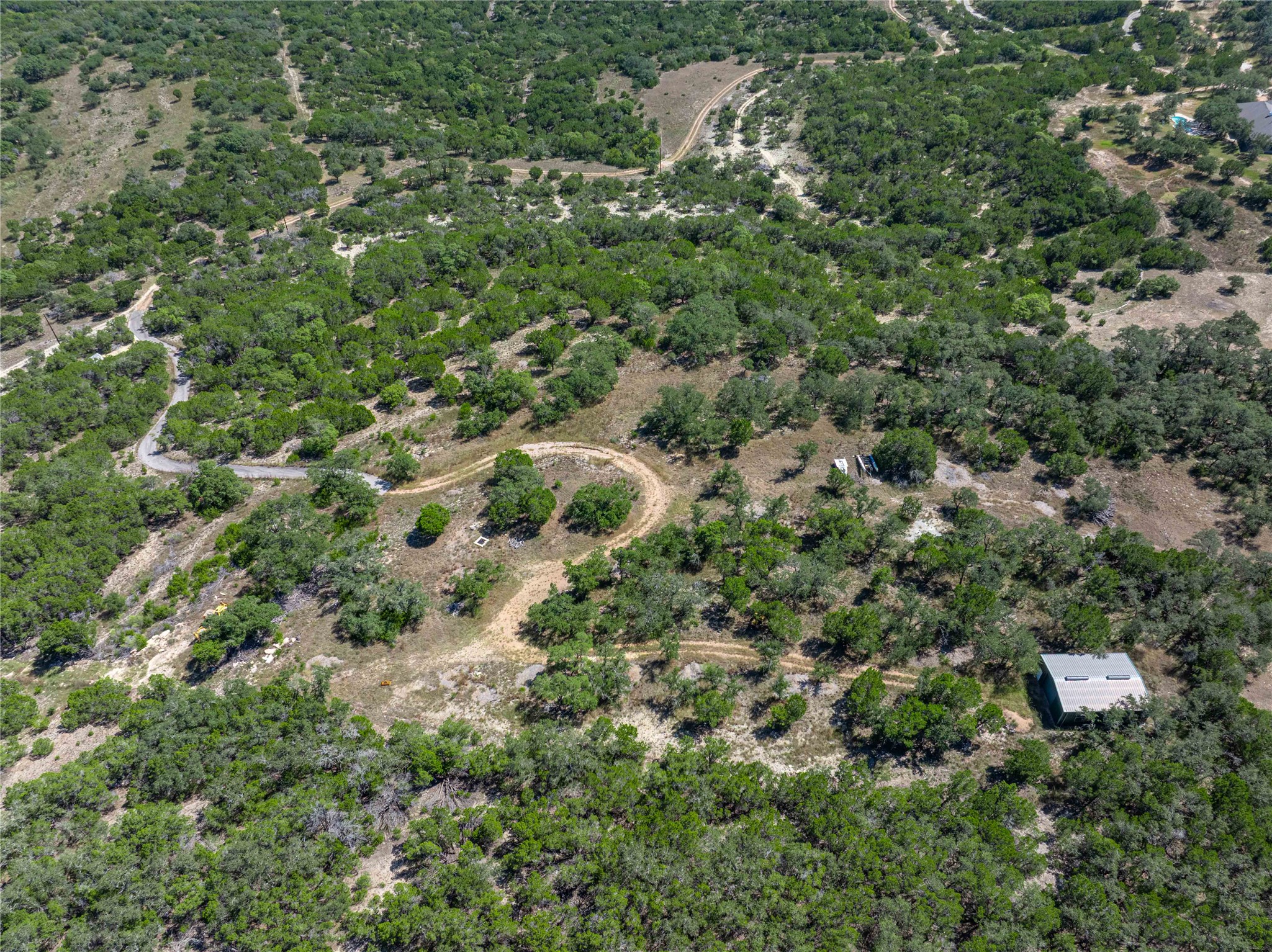 0 Post Oak Bend Loop Marble Falls, TX 78654 - Photo 15 of 18 an aerial view of residential house with outdoor space and trees all around