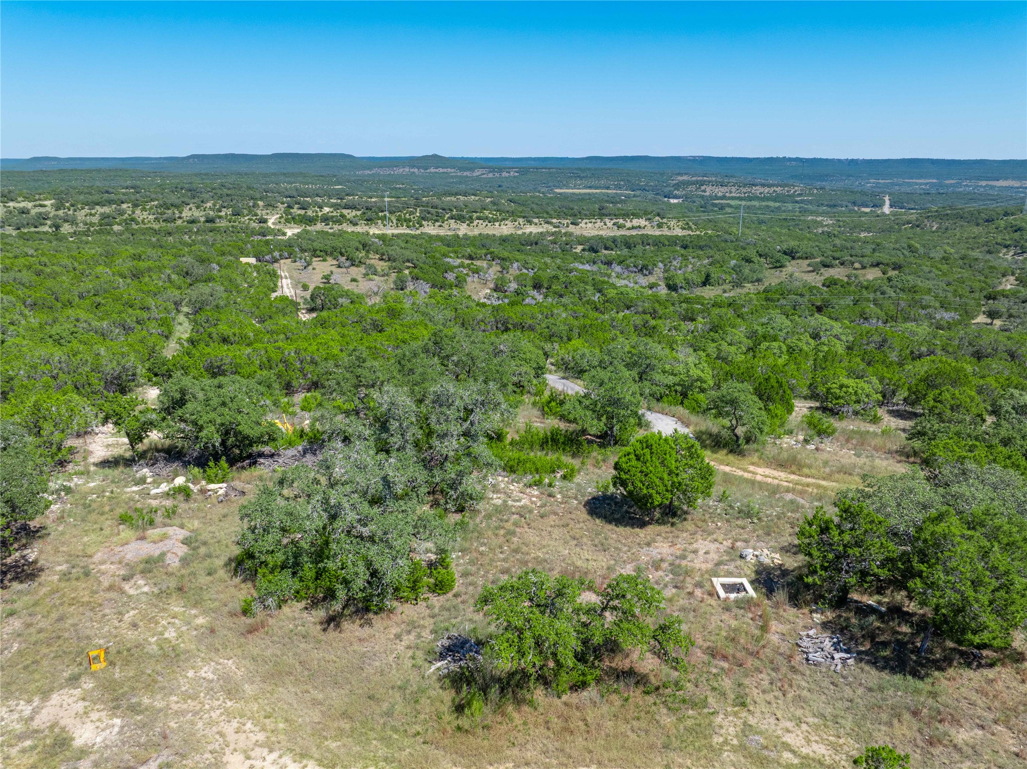 0 Post Oak Bend Loop Marble Falls, TX 78654 - Photo 2 of 18 a view of a lush green forest with houses